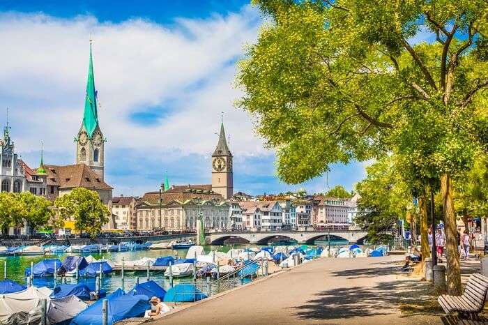 Panoramic view from Lake Zurich of the historic Zurich city center with famous Fraumunster and St. Peter Churches