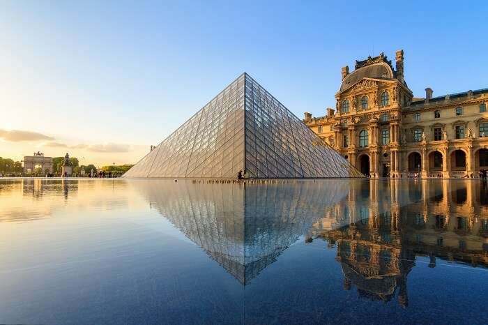 The Louvre museum pyramid at sunset in Paris