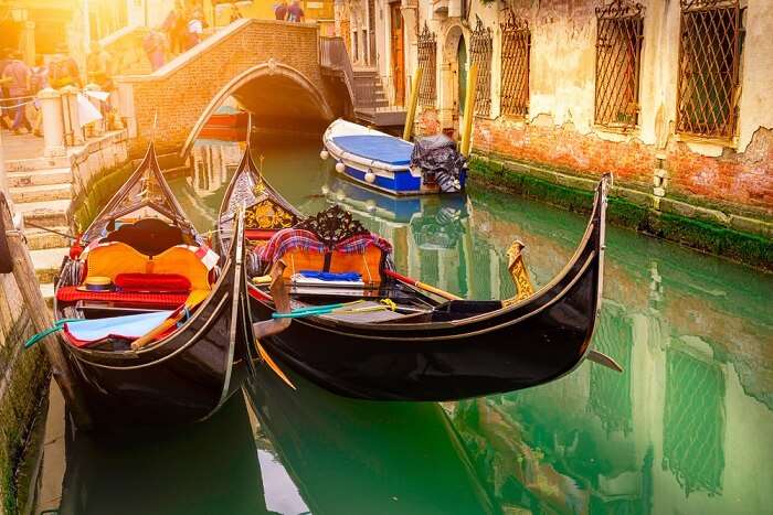 Canal with two gondolas at Venice in Italy