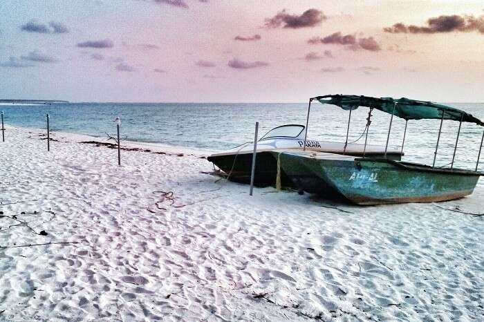 Two boats on the white sands of Kadmat Beach