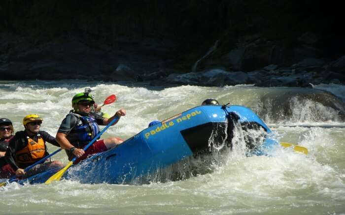 A boat cruising in Tamor River in Nepal