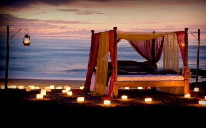 A romantic dinner setup by the sea beach in Canggu