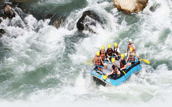 Adventurers fighting wave in Bheri river in Nepal