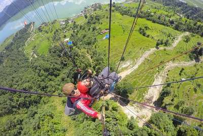 narayan enjoying paragliding in nepal