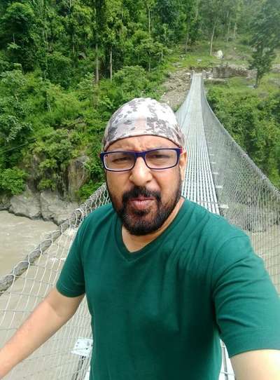 narayan taking selfie on bridge on his nepal trip