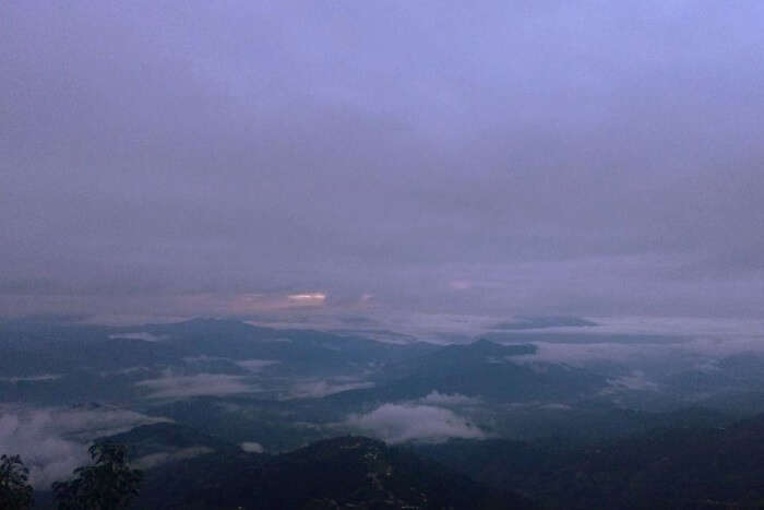 narayan watching splendid views from hotel in nagarkot on their romantic nepal trip