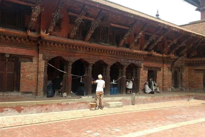 narayan and wife strolling in the interiors of nepal temple