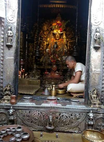 narayan and his wife seeking blessings at hindu temple in nepal