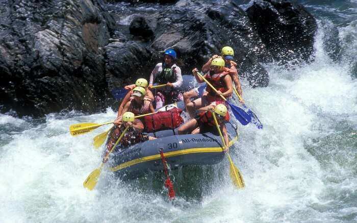 Rafters trying to maintain balance while rafting in Nepal