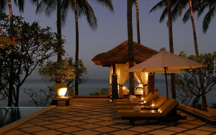 Seating area by the pool overlooking ocean in Canggu near Bali