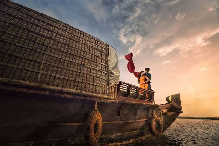 couple spending romantic moments on houseboat in alleppey