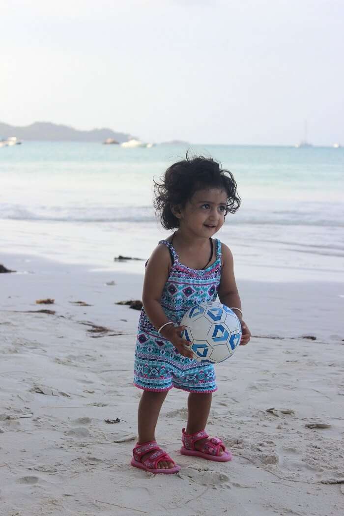 kid at a beach in seychelles