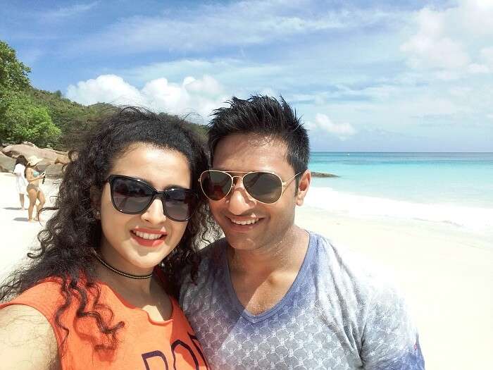 sulabh and his wife on a beach in seychelles
