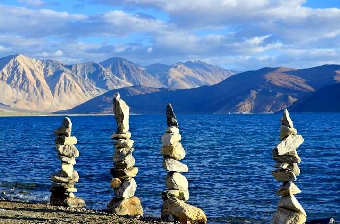 incredible cairns at pangong tso in Ladakh which is one of the best places to visit in North India