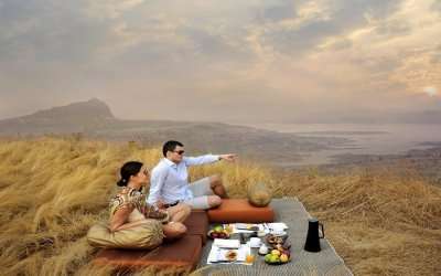 A couple sitting in a resort near Mumbai
