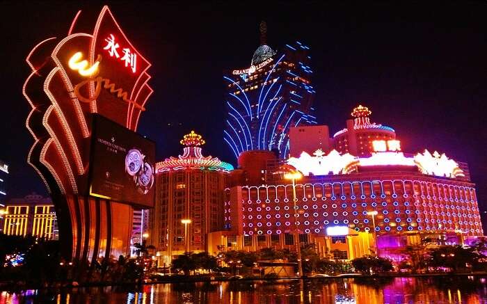 A well lit casino and other buildings 