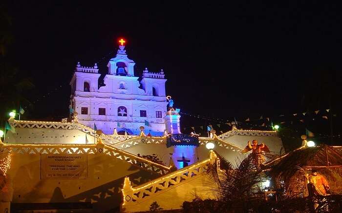 A well lit church at night in goa 