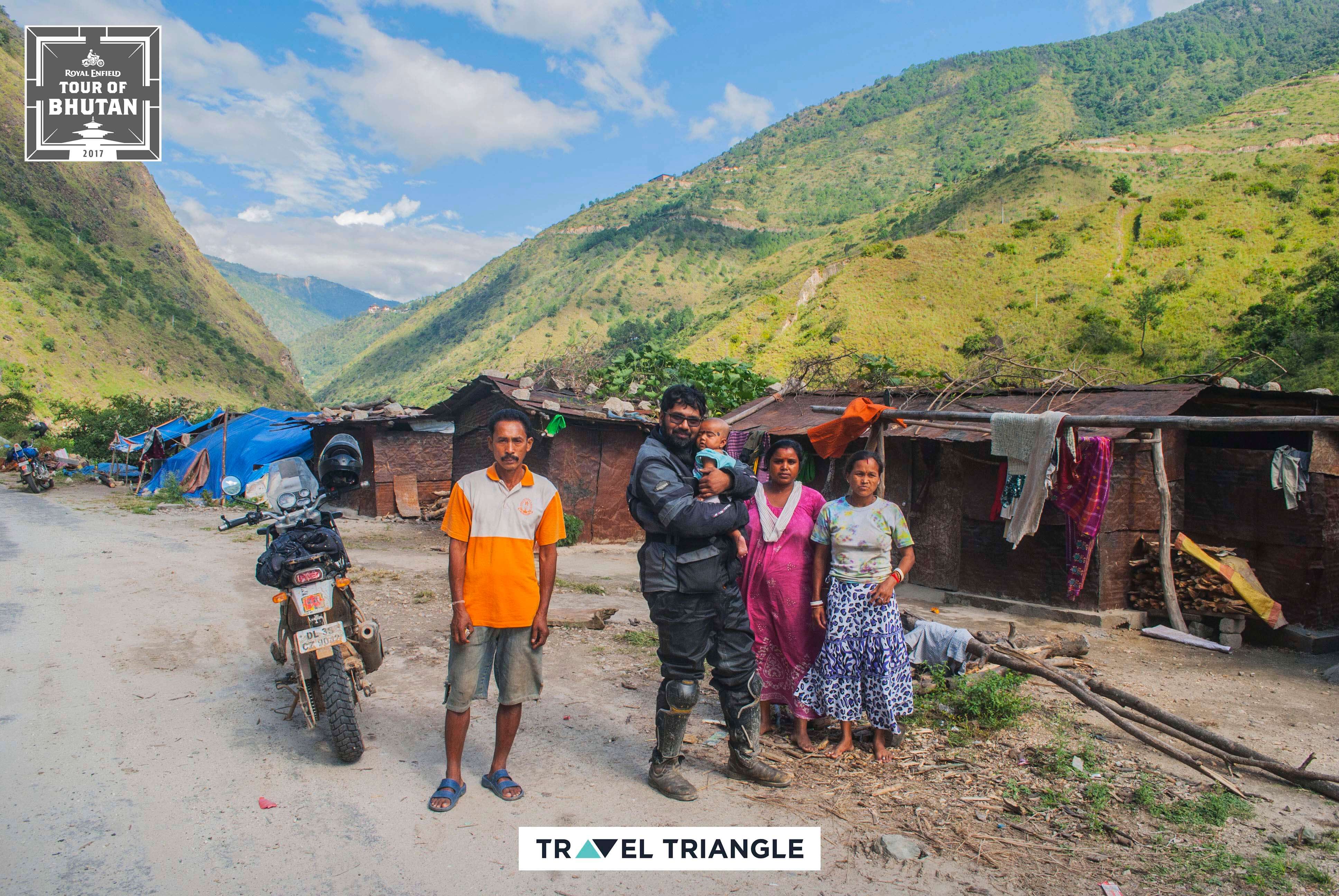 Mongar to Trashigang: riders meeting a family of friendly bhutanese people