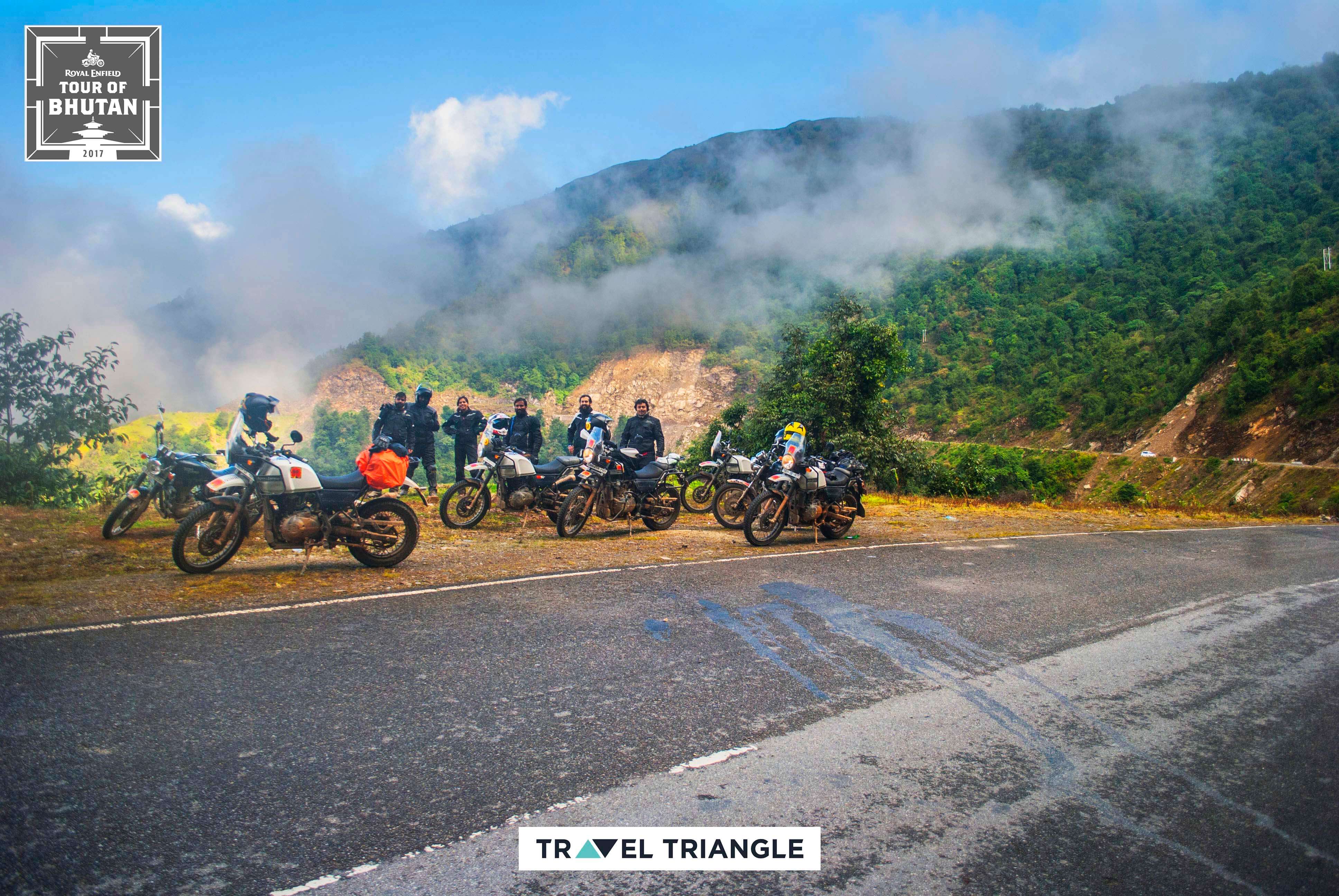 Trashigang to Samdrup Jongkhar: riders taking rest on a hill