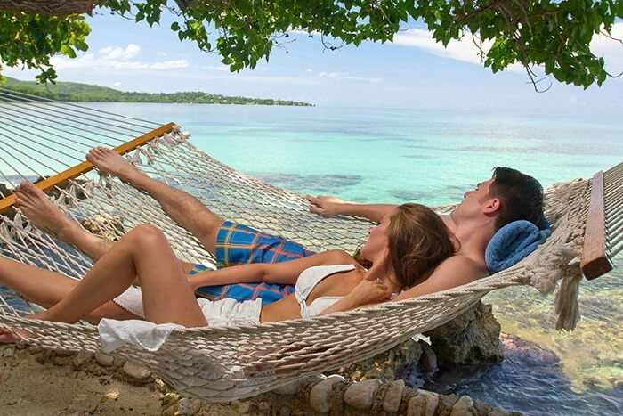 a couple enjoying beach time on their honeymoon in Jamaica