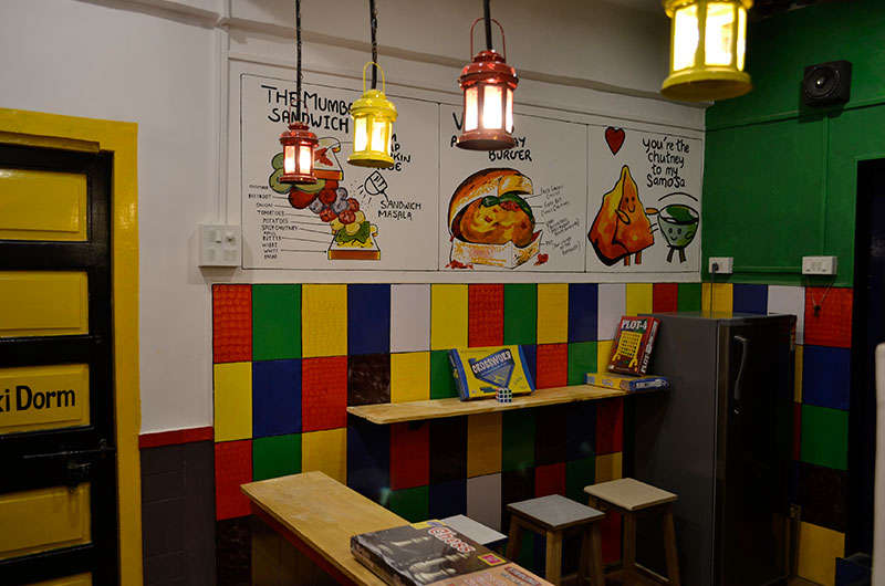 a colourful kitchen of a hostel