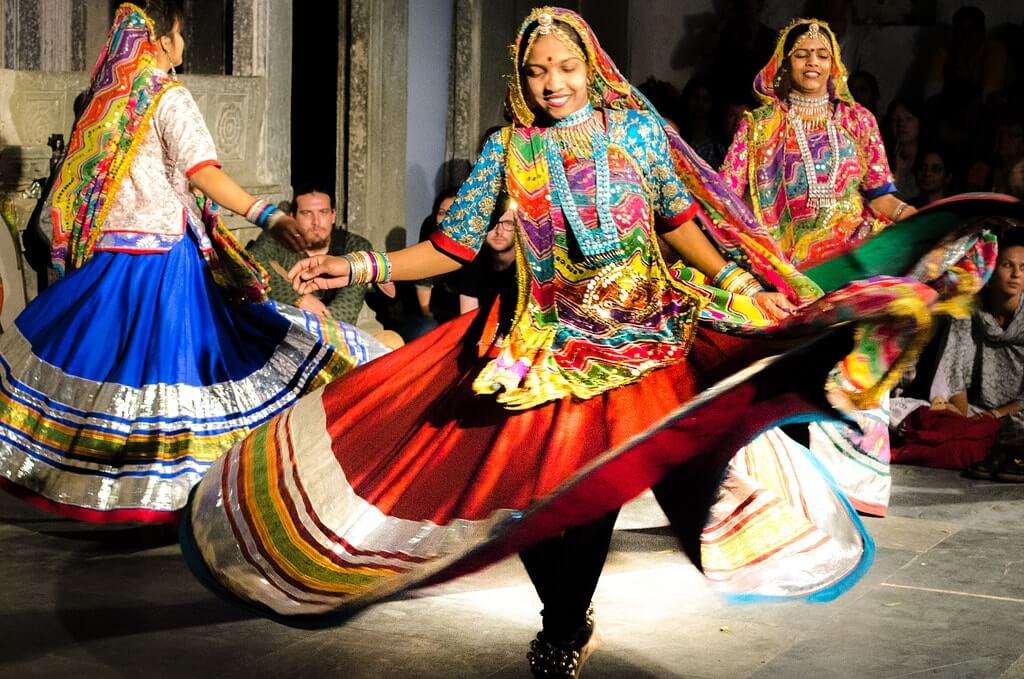 women dancing in traditional attire