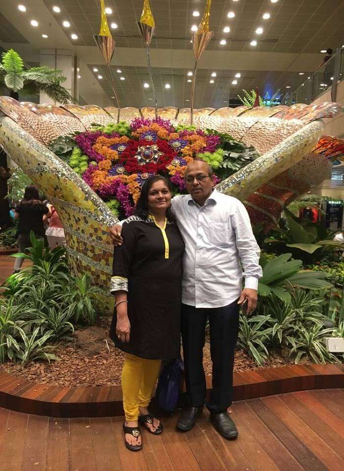 saurabhi singapore family trip: parents posing in the cruise