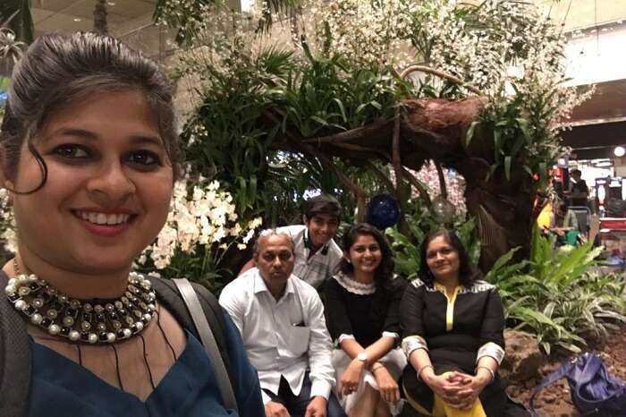 saurabhi singapore family trip: saurabhi with parents posing in the cruise