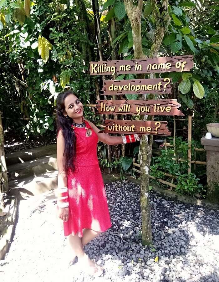 pankaj honeymoon trip to bali: posing near clean bali sign