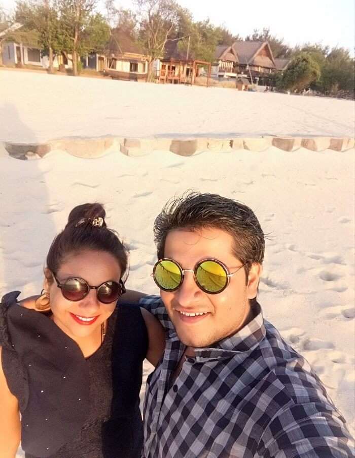 pankaj honeymoon trip to bali: pankaj & wife on beach in gili