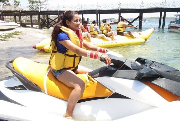 pankaj honeymoon trip to bali: pankaj's wife posing on a jetski