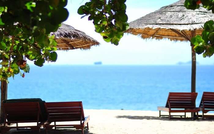 Relaxing chairs laid by the sea beach at Pali Beach Resort in Mumbai