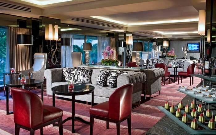 Sofas placed in cafe of a luxurious hotel 