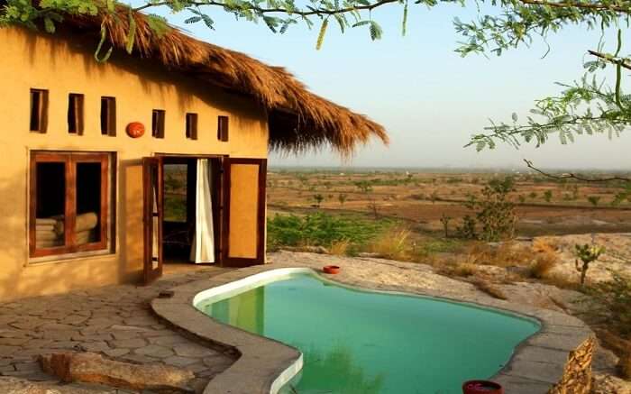 View of private pool with cottage in Lakshman Resort