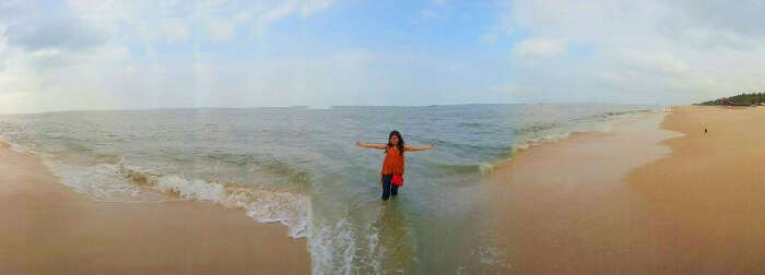 female traveler enjoys on a Kerala beach