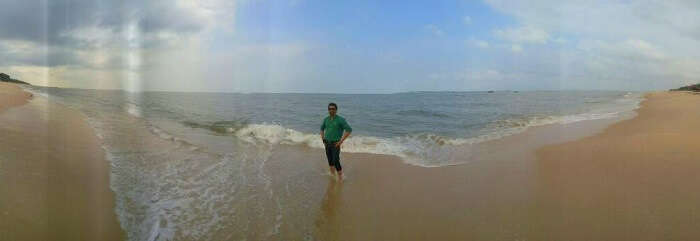 male traveler enjoys on a Kerala beach