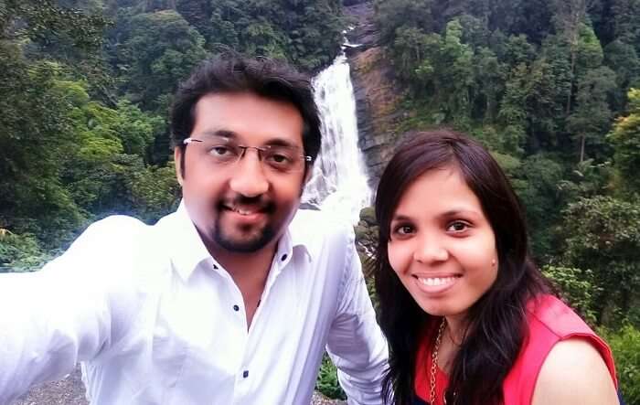 Couple near waterfalls in Kerala