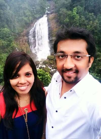 Couple near waterfalls in Kerala