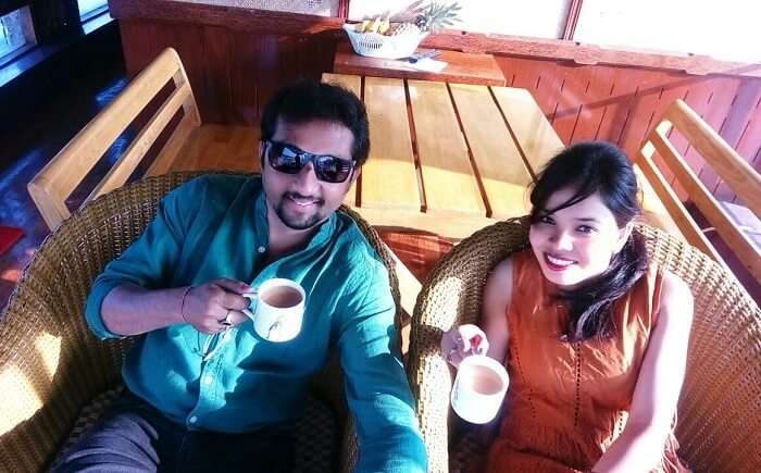 Couple enjoying breakfast on a houseboat