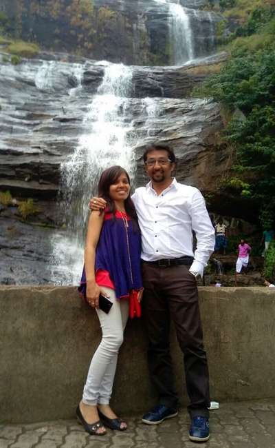 Couple near waterfalls in Kerala