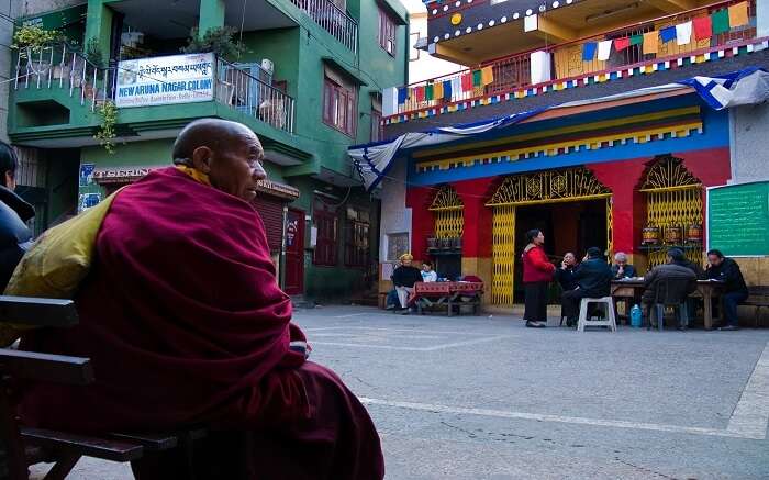 A monk sitting in the monastery complex in Majnu Ka Tila in New Delhi