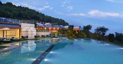 a swimming pool in a hotel in mountains