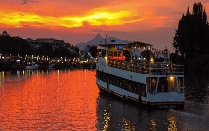 One of the Mandovi River Cruises in Goa sailing into the sunset 