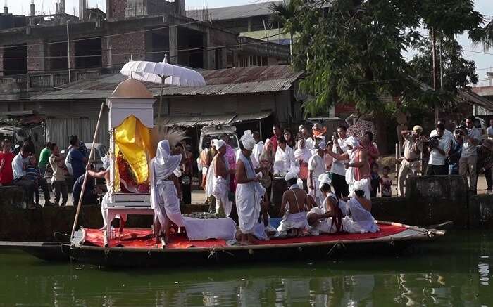 People of Manipur on a boat during a festival 