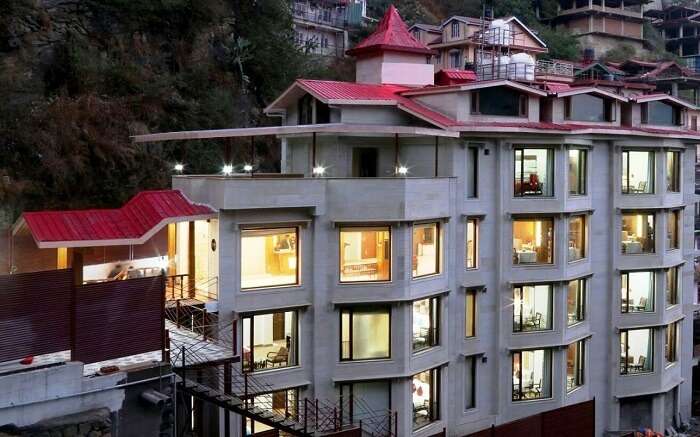 View of a well-lit Rock Castle Hotel in Shoghi