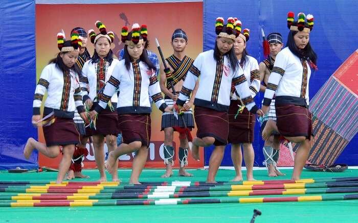 Young girls of Manipur performing bamboo dance 