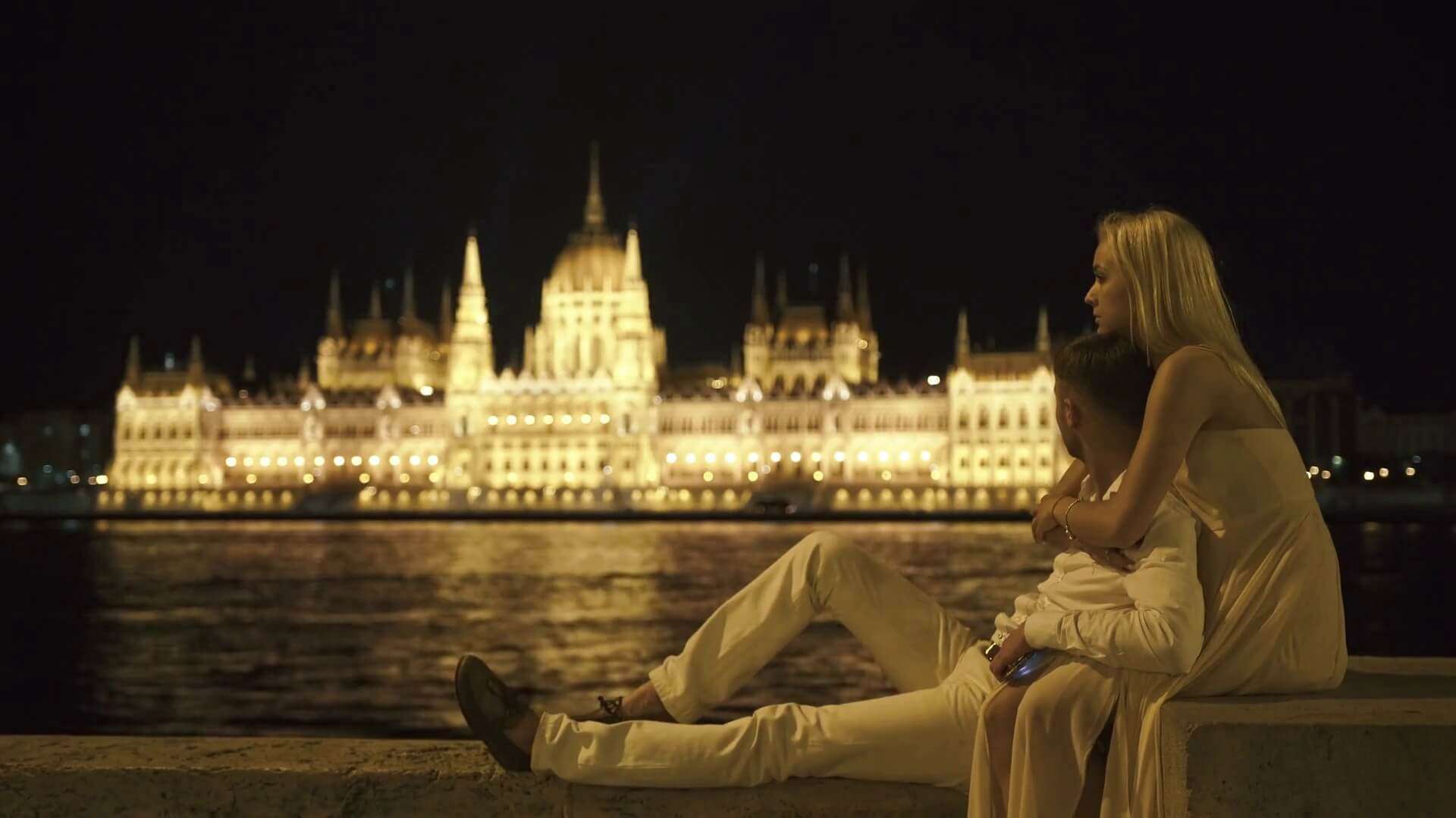 a couple sitting by the waters in Budapest