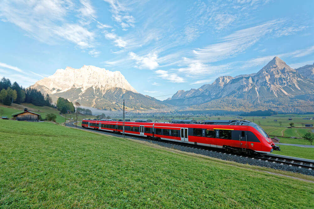a red train in Swiss alps