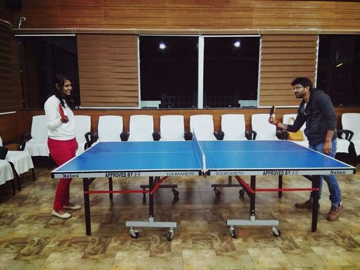 Couple playing table tennis