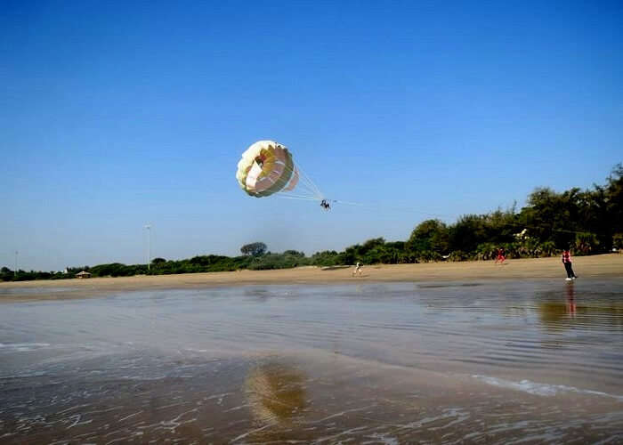 Enjoy Parasailing at one of the best places to visit in Daman at Devka Beach